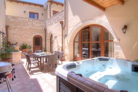 A wonderful outdoor jacuzzi tub awaits you at the terrace!
