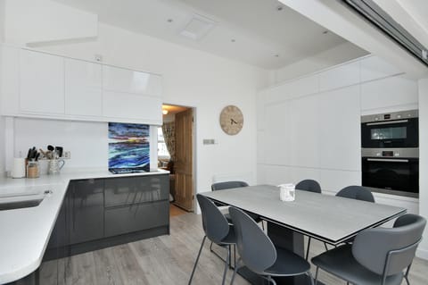 Kitchen . Table extends to accomodate 10