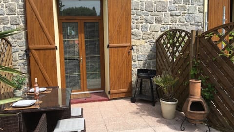 Patio area in rear garden overlooking pool area 