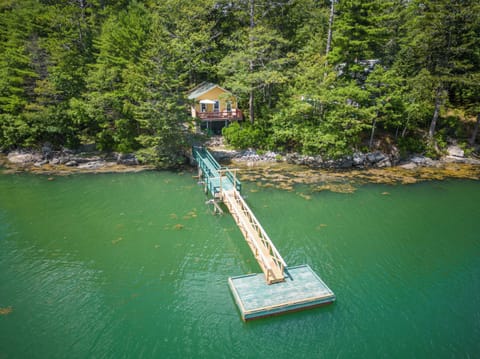 Aerial view of cottage and dock