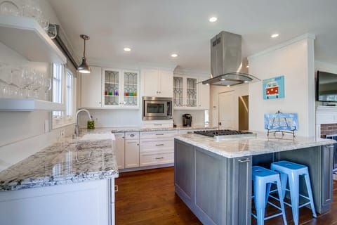 Updated and fully-stocked kitchen.