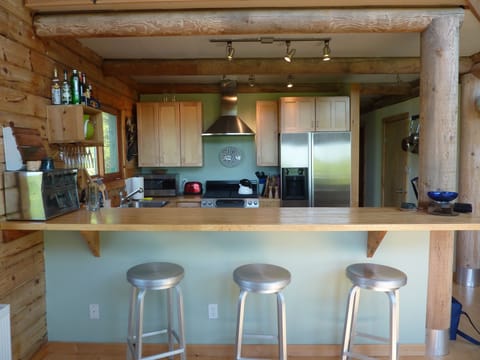 Breakfast bar adjacent to open kitchen