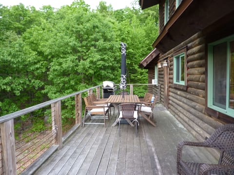 Dining table on wraparound porch comfortably seats 6