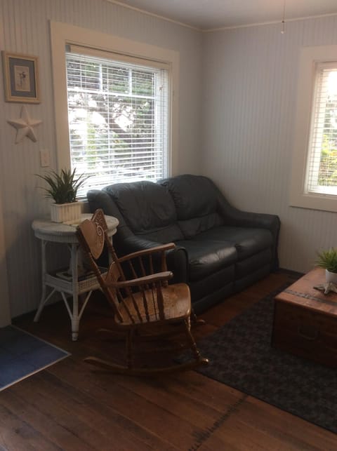Living Area w/ reclining sofa, rocker, & then on the opposite wall the 2nd sofa.