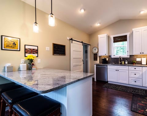 Kitchen facing back door to deck area.