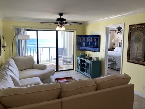 Living Area With Sectional Sofa and 65 inch HD TV