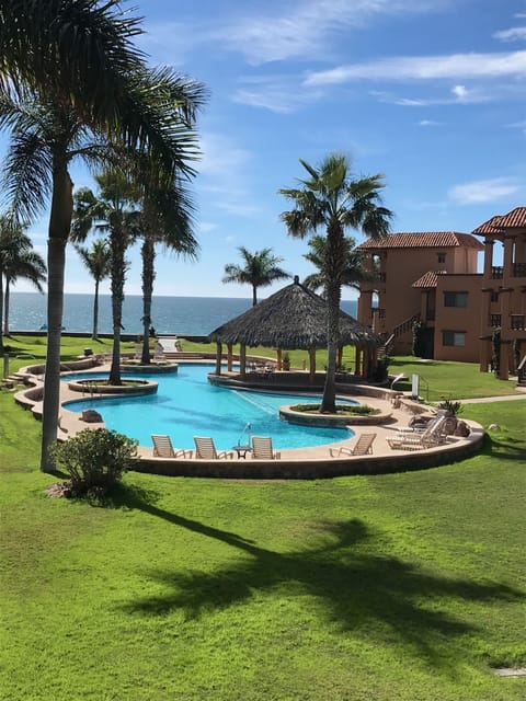 Pool and ocean right outside condo. View from Patio.