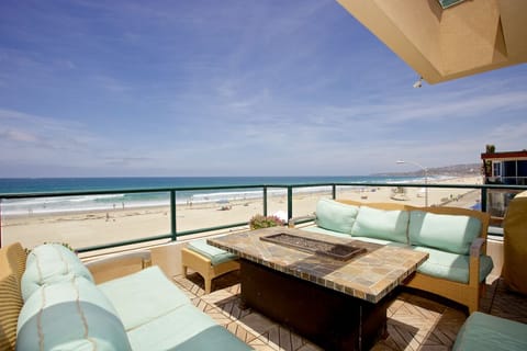 Penthouse deck with seating around fire table & gas BBQ