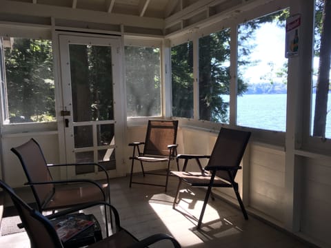 Read a book on the screened-in porch overlooking the lake.