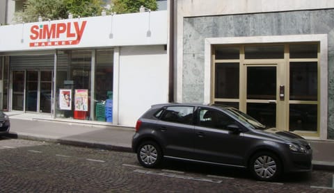 The AUCHAN supermarket sharing a wall with my building entrance
