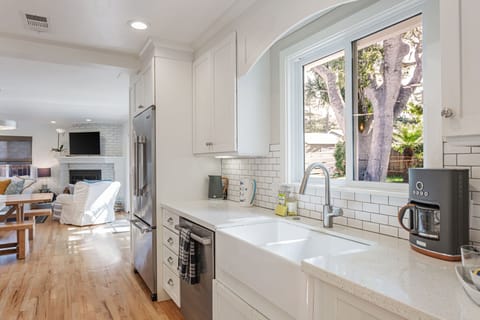 Kitchen window/sink with views out to the backyard