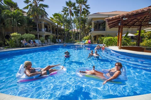 Pool area with pool for adults, kids and one jacuzzi.