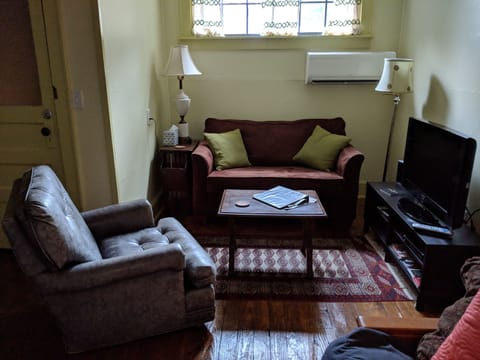 TV/living room with love seat and chair.