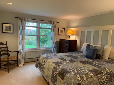 Master bedroom with a king bed, full bath.   Mountain views