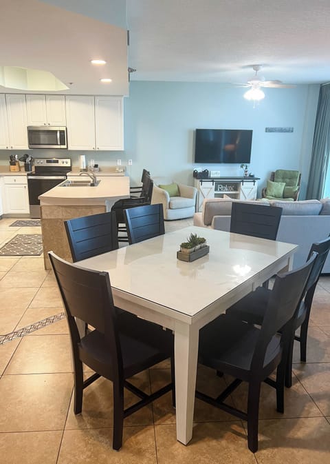 View of dining room and living room and kitchen.