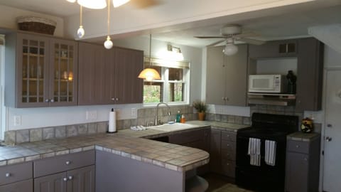 Country kitchen with SS appliances, MW, coffee maker, etc.