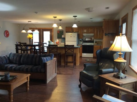 View of living room, kitchen and dining room 