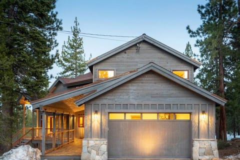 Large 2 car garage with EV charger, long covered porch entry way.