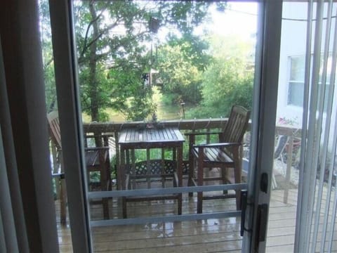 Looking out back of condo on to the deck & patio overlooking pond, very peaceful