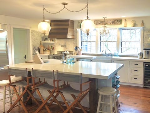 Ilve range with gas burners, griddle plate; full complement of kitchen supplies