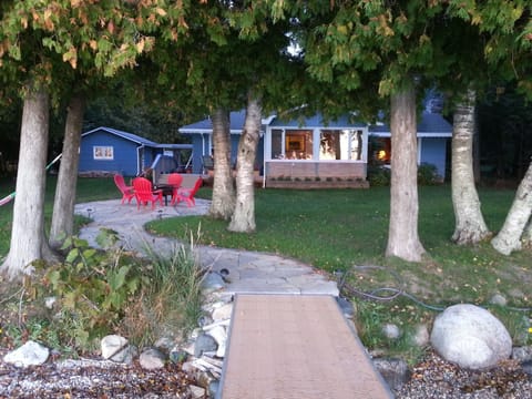 The pathway from the water's edge to the cozy cottage.