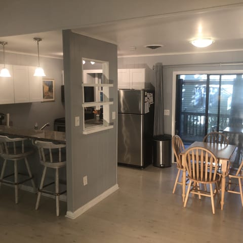 The breakfast bar with service window and the dining space. 