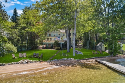 Expansive flat lawn, wide fine sand beach and gradually sloping sand bottom