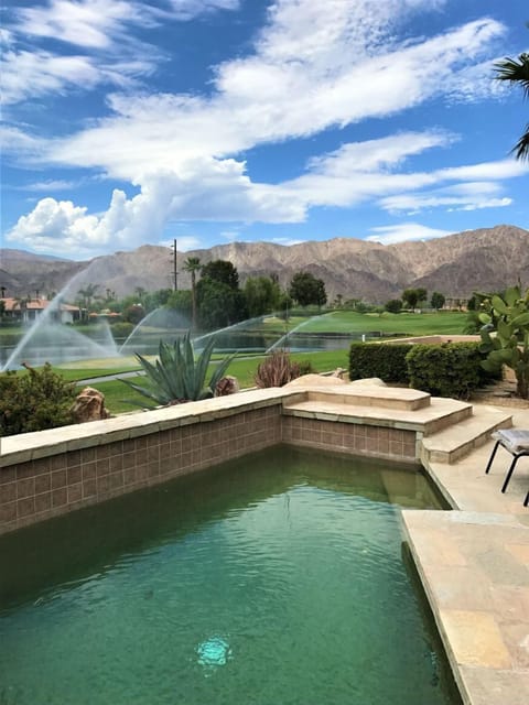 Million Dollar views from the backyard across the lake and greens.