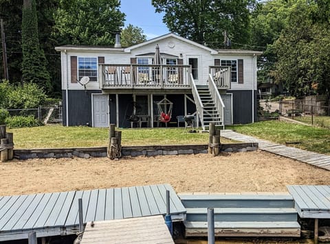 Lake side view of house with small beach for the kids (back)