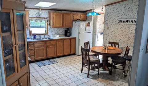 Family heirloom table with 4 chairs. Additional 3 chairs in living room.