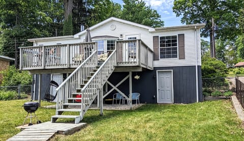 Back side showing stairs to upper rental space and grill location.