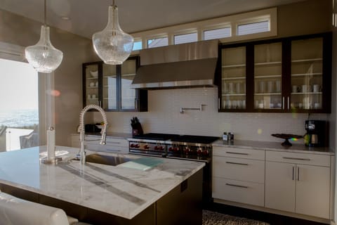 double Wolf cooktops with 8 burners, two ovens, gourmet cooking kitchen
