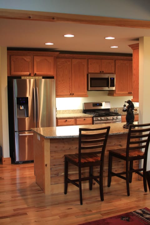 View of kitchen with Refrigerator, oven, Microwave