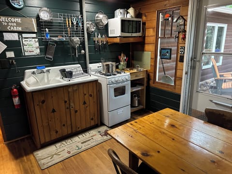 The kitchen is "cabin cozy" and has everything you need. Cook up a pot of soup!