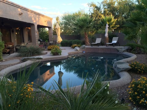  Relax in our backyard oasis with a lounging pool, tanning deck and seating.