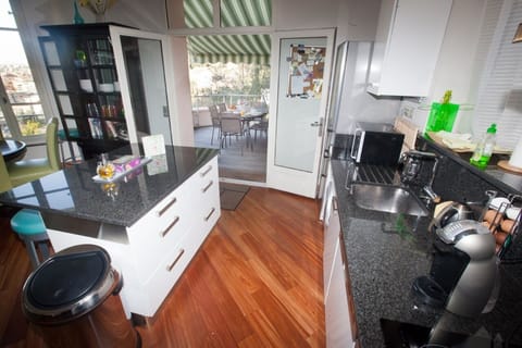 Fully equipped stylish kitchen, opens onto outdoor deck