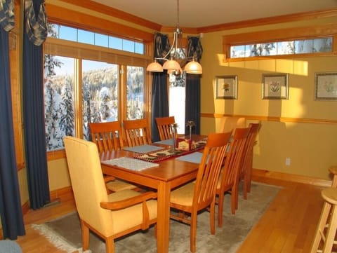 Dining table seats eight. Bright, open, a great view of Silver Star.
