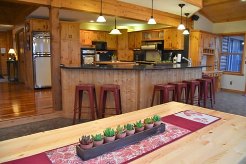 Abundant seating.  6 at the table & 8 around the wrap around quartz counter top.