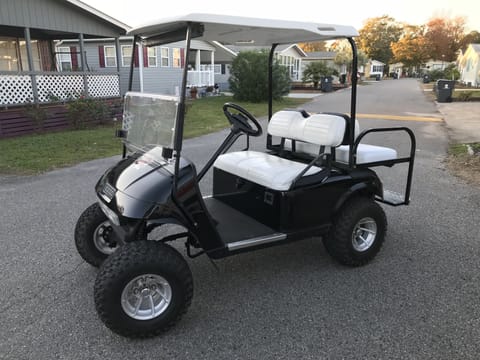 Take our golf cart to the beach or a ride around the village