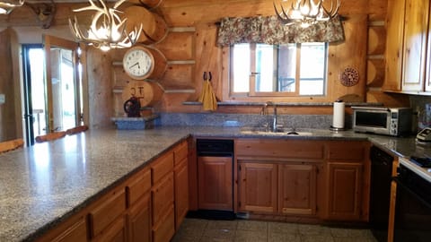 Huge kitchen, granite counters and 6 barstools, large work area