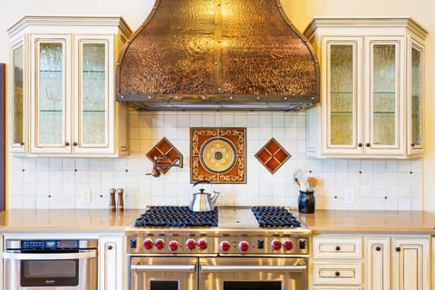 Kitchen with Viking stove, oven, sink, cooking equipment