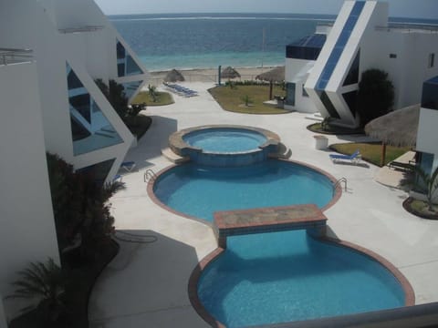 Balcony View overlooking swim pool and beach