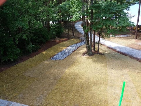 View from back upstairs deck. Gravel road to dock.