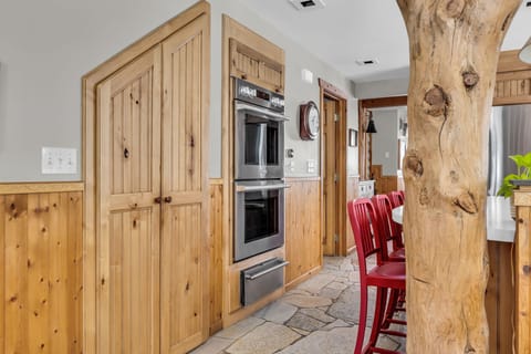 pantry and double ovens and warming drawer