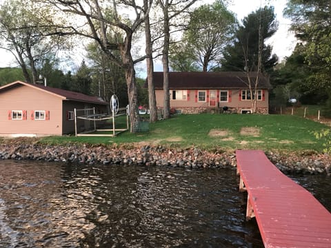 Main lake home with dry boat house on the left