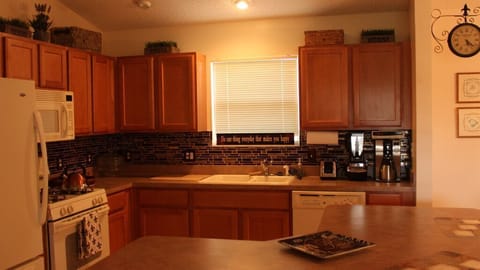The kitchen island offers plenty of space to cook up wonderful meals!