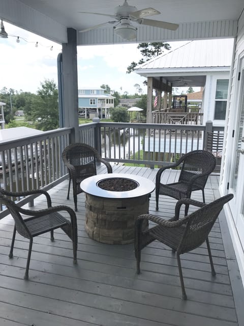 firepit on front porch with seating for 4