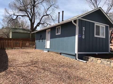 Exterior with large off street parking/driveway and fenced in backyard.
