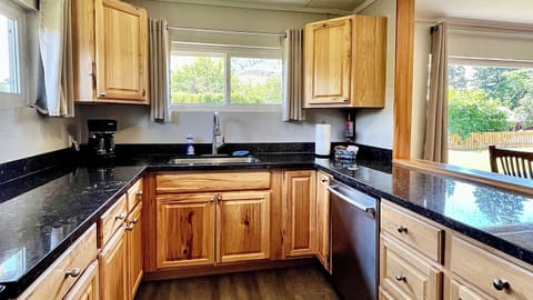 Kitchen with granite countertops and stainless steel appliances
