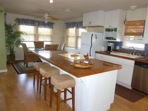 Fully equipped gourmet kitchen with ocean view dining table